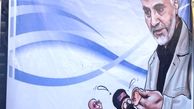  قاسم سلیمانی در حال پیچاندن گوش یک داعشی /عکس