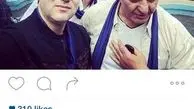 عکس آقای خواننده کم کار در کنار مرد متواضع کشتی ایران