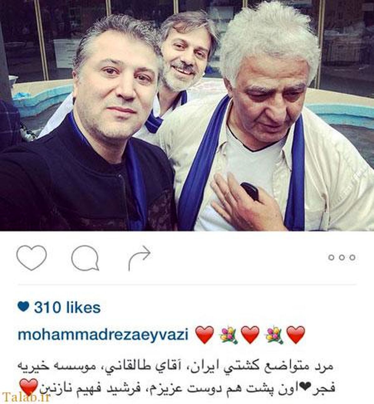 عکس آقای خواننده کم کار در کنار مرد متواضع کشتی ایران