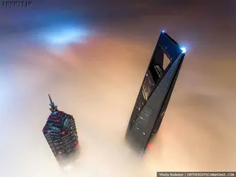 the-stunt-took-them-a-total-of-20-hours-since-they-entered-the-tower-at-night-scaled-the-crane-during-daybreak-and-waited-for-the-light-to-rise-to-capture-dream-like-views-of-the-neighboring-jin-mao-to1