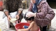 پژمان جمشیدی در حال حمام کردن پسرش + عکس