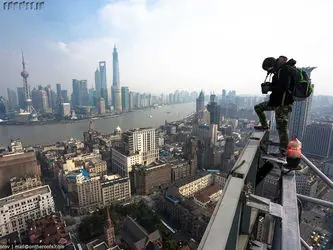 they-even-climbed-billboards-to-get-overarching-shots-of-shanghais-seaport-and-its-array-of-skyscrapers1